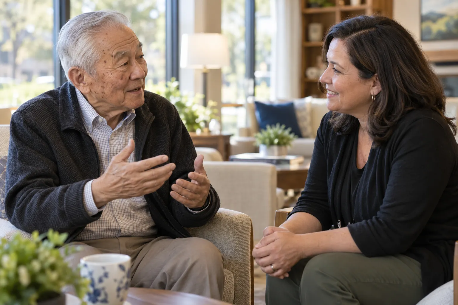 Illustrative scene: an older man tells a story to an attentive activity facilitator.